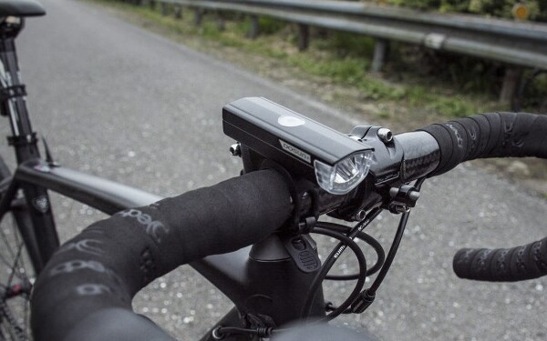 Why do bicycle front lights need to meet the German bicycle lighting equipment testing standard (StVZO)?